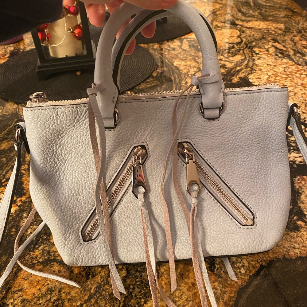 Rebecca Minkoff light blue leather satchel with fringe detailing.